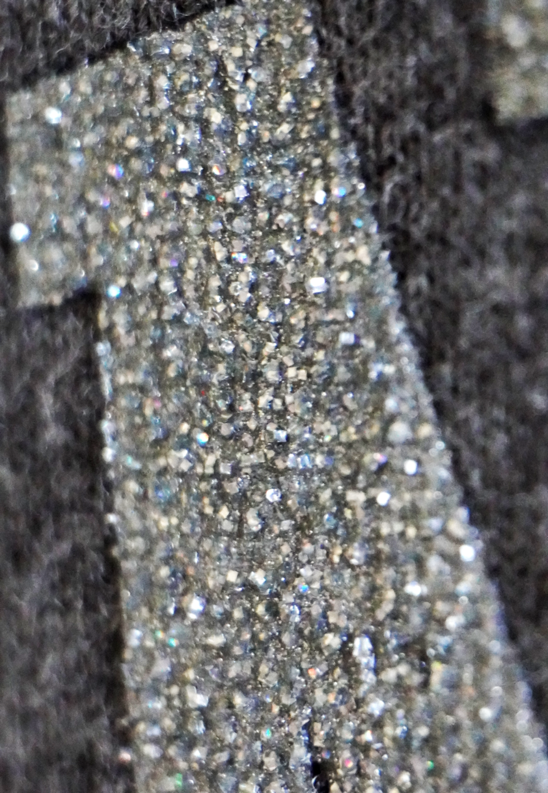 Crystalina, Specialty Ink, Close-up of a textured surface with a pattern of small, reflective dots.