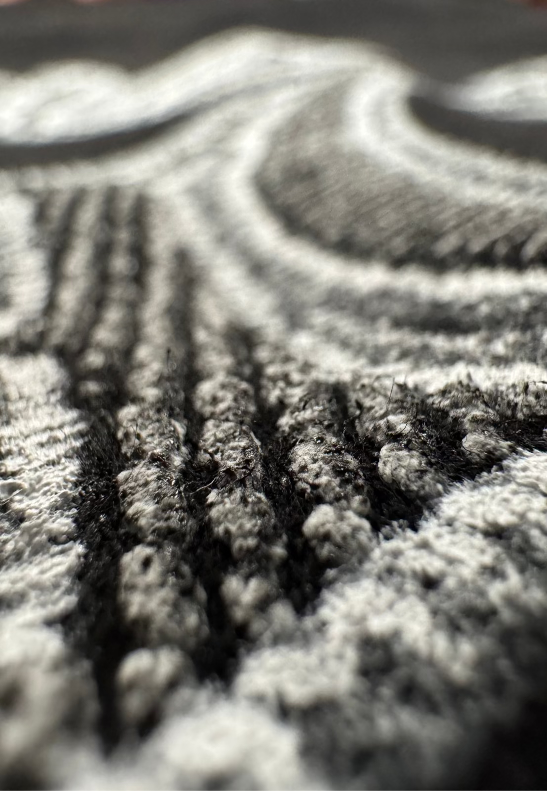 Specialty Ink, Puff, Close-up of a puff specialty ink with embroidered patterns